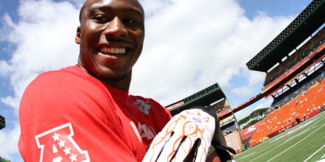 Miami Dolphins wide receiver Brandon Marshall smiles after making a reception during pregame warm up at the Aloha Stadium during National Football League's 2012 Pro Bowl game in Honolulu, Hawaii, Jan. 29, 2012.