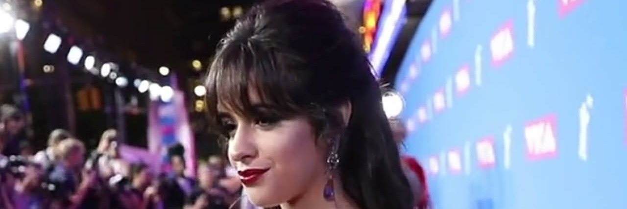 Camila Cabello poses on the VMA Red Carpet