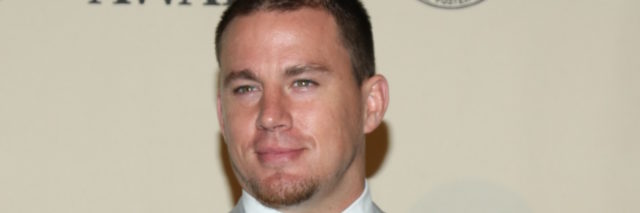 Channing Tatum in a grey suit on the red carpet