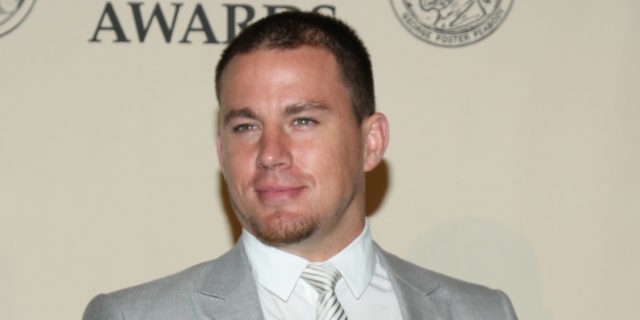 Channing Tatum in a grey suit on the red carpet