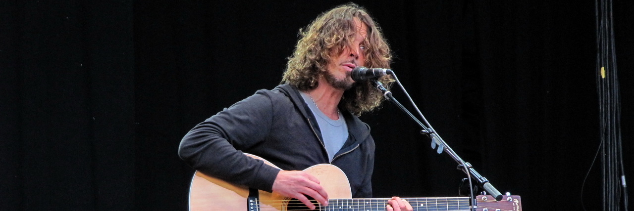 Chris Cornell's Family Sues Doctor Over The Singer's Death Chris Cornell sings and plays his guitar onstage