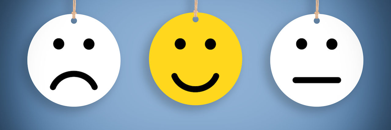 What Emotional Responses to COVID-19 Outbreak Mean Three hanging smilely faces, one sad, one happy and one neutral