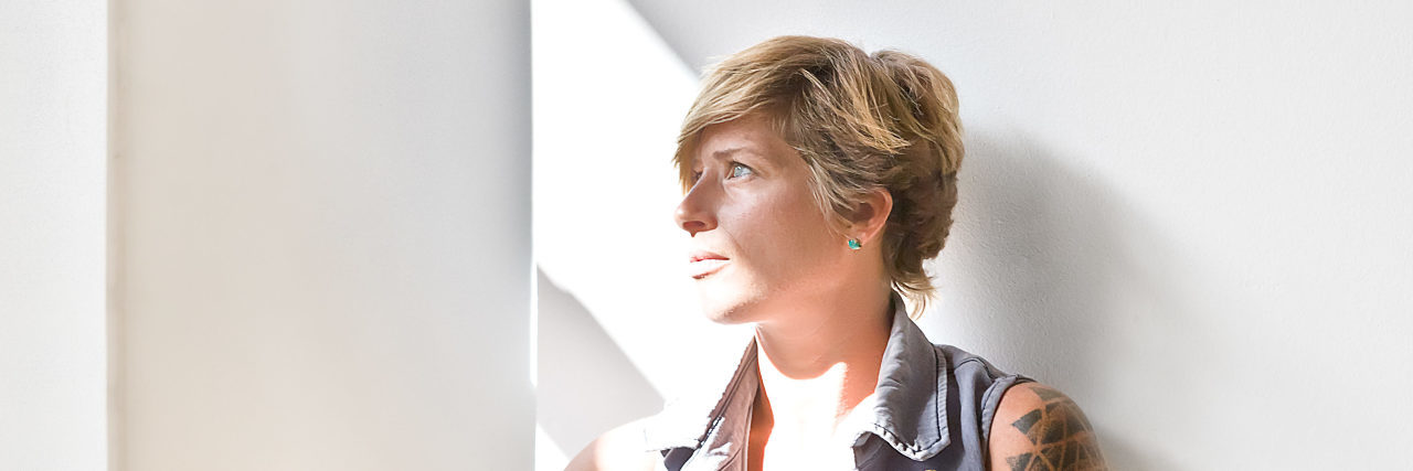 Experiencing Guilt Because of Chronic Illness Woman looking down at the floor sadly.