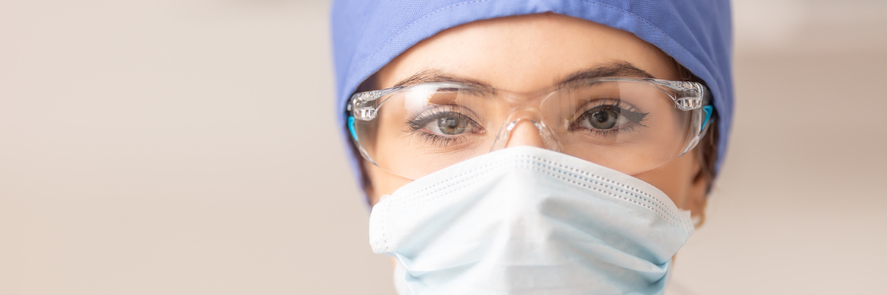 Emails Show Health Officials Warned Early on About Equipment Shortages Portrait of female doctor in special surgical sterile protective clothing.