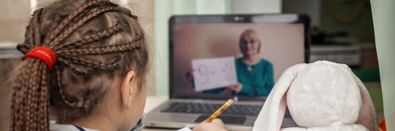 Making Online Learning Accessible During COVID-19 Girl studying math during her online lesson at home.