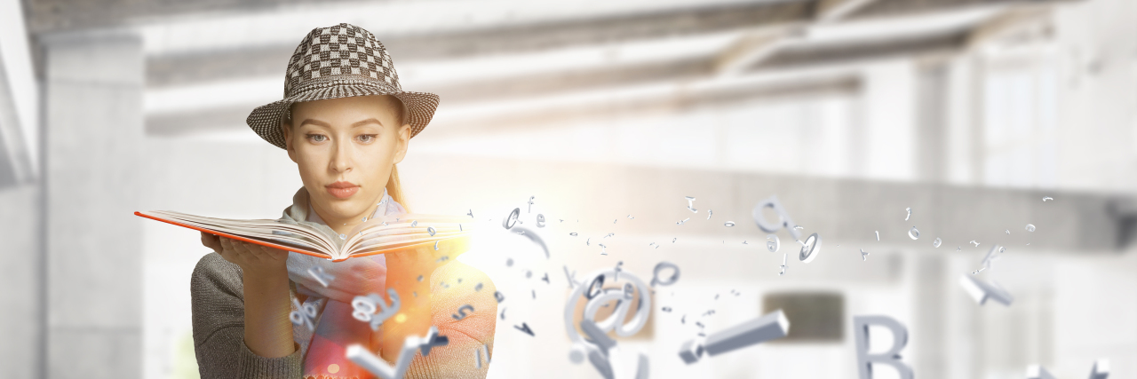 I'm Proud of My Autistic Superpowers Woman reading book with letters and numbers floating in the air.