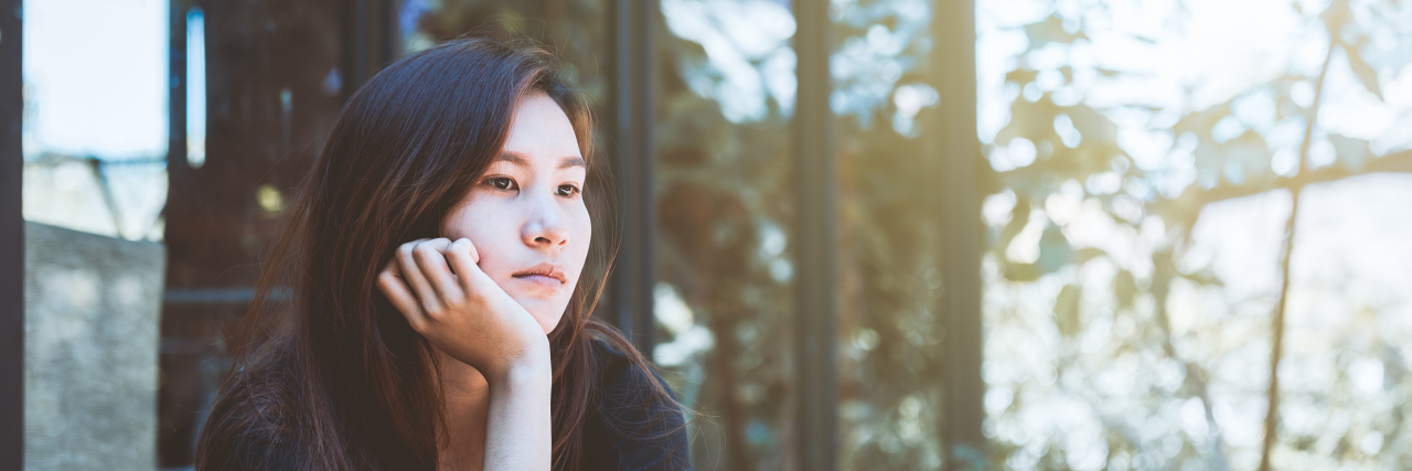 How the Coronavirus Pandemic Is Affecting Many People With Autism Young Asian woman who looks stressed out.