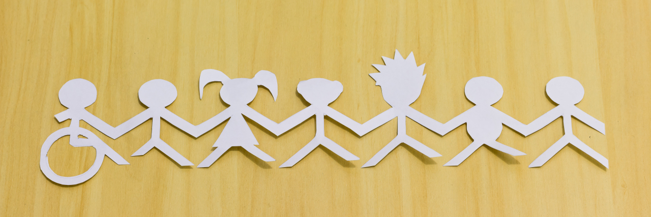 Feeling Isolated as a Lesbian With Multiple Sclerosis Social inclusion, paper cutouts of wheelchair user and other diverse people.