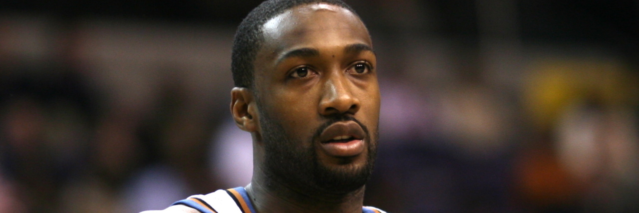 Former NBA Player Makes Insensitive Remark About Down Syndrome Gilbert Arenas holds a basketball during a game on court