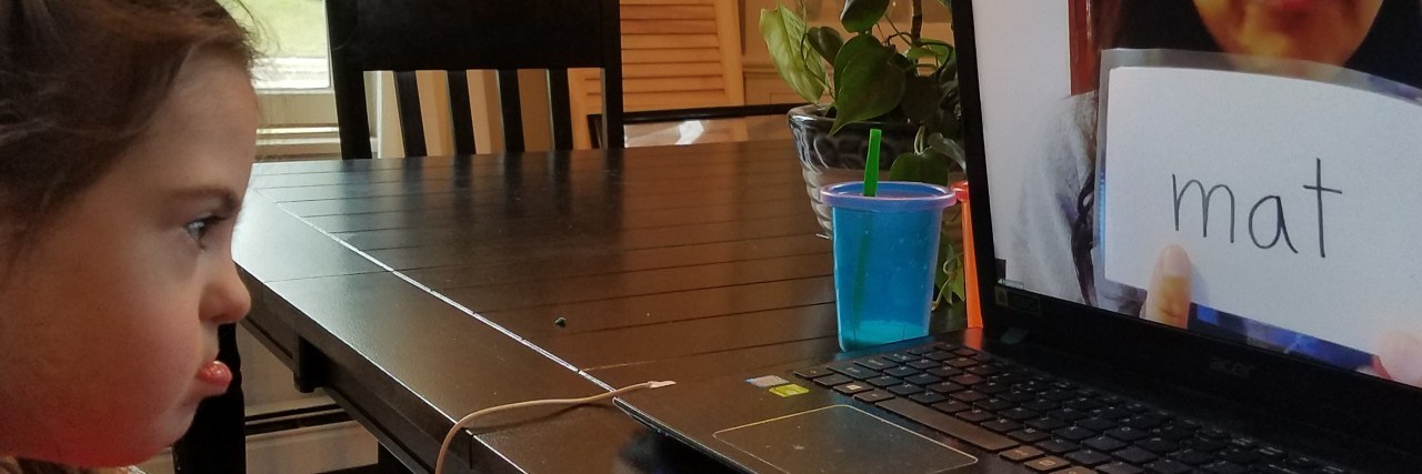 Online Therapy Tips for Preschoolers With Disabilities During COVID-19 Tina's daughter doing online learning.