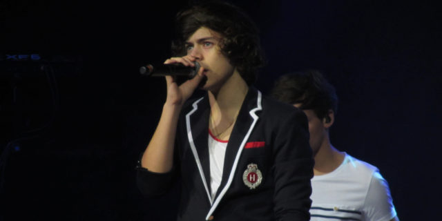 Harry Styles singing onstage