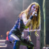 Jill Janus performs onstage in an all-black ensemble