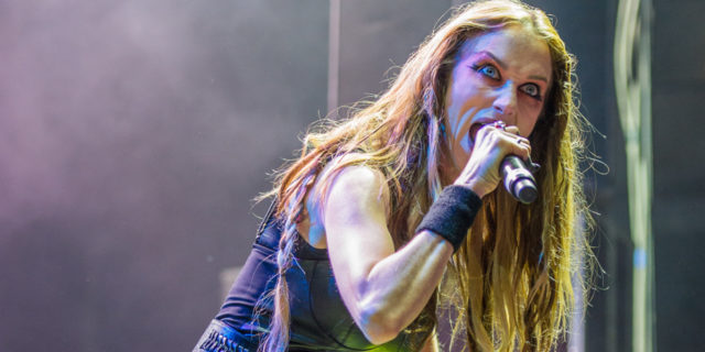 Jill Janus performs onstage in an all-black ensemble