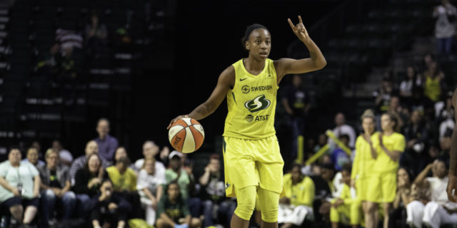 Jewell Loyd dribbles a basketball on the court