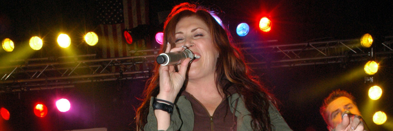 Jo Dee Messina performs at a concert.