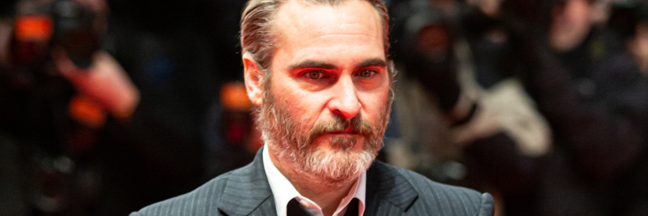Joaquin Phoenix as Disabled Cartoonist John Callahan Is Offensive Joaquin Phoenix on a red carpet