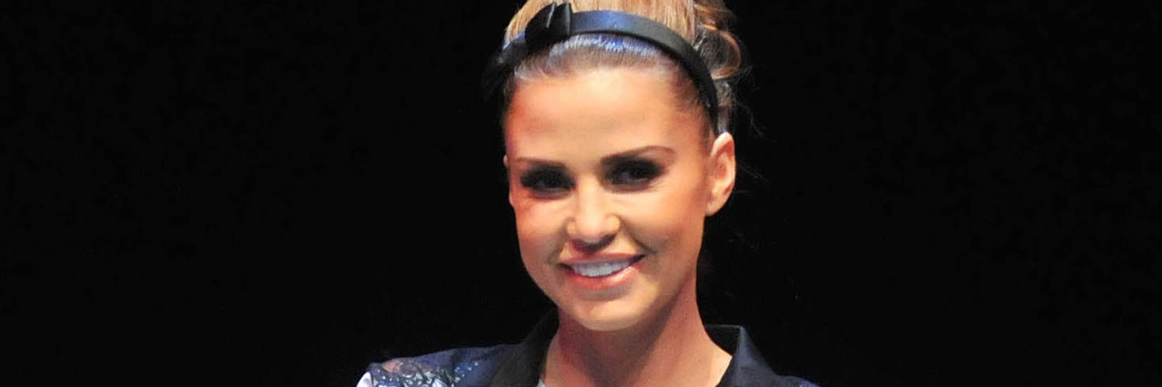 Katie Price Says Comment on Aborting Pregnancy Katie Price sits down at a panel in a black chair