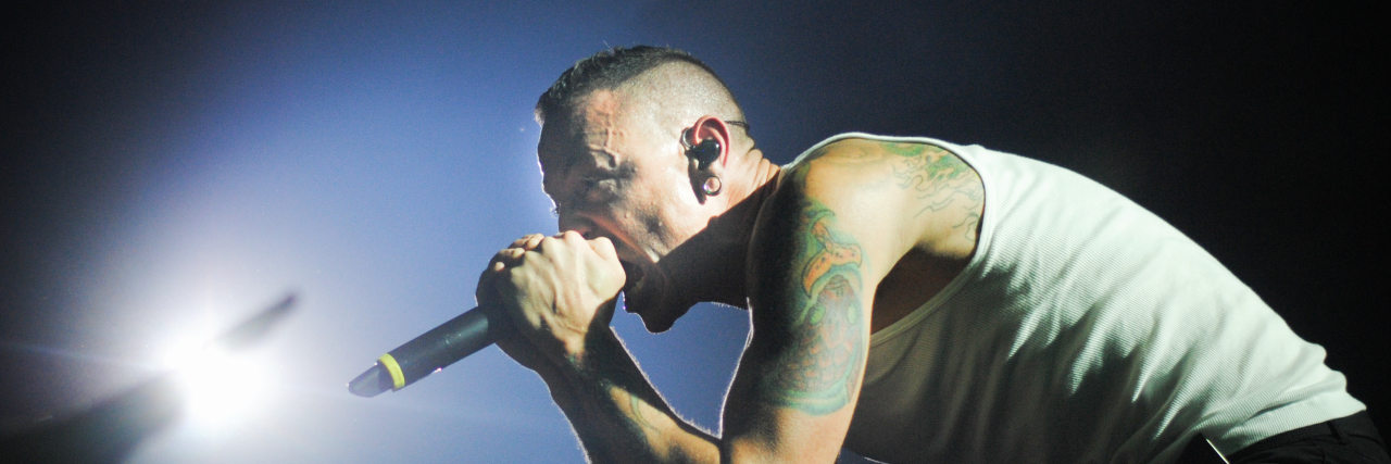 Linkin Park Singer Chester Bennington Dies By Suicide Chester Bennington singing into the audience at a concert