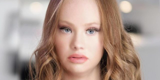 A portrait of Madeline Stuart looking at the camera