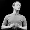 A black and white photo of Mark Zuckerberg speaking onstage