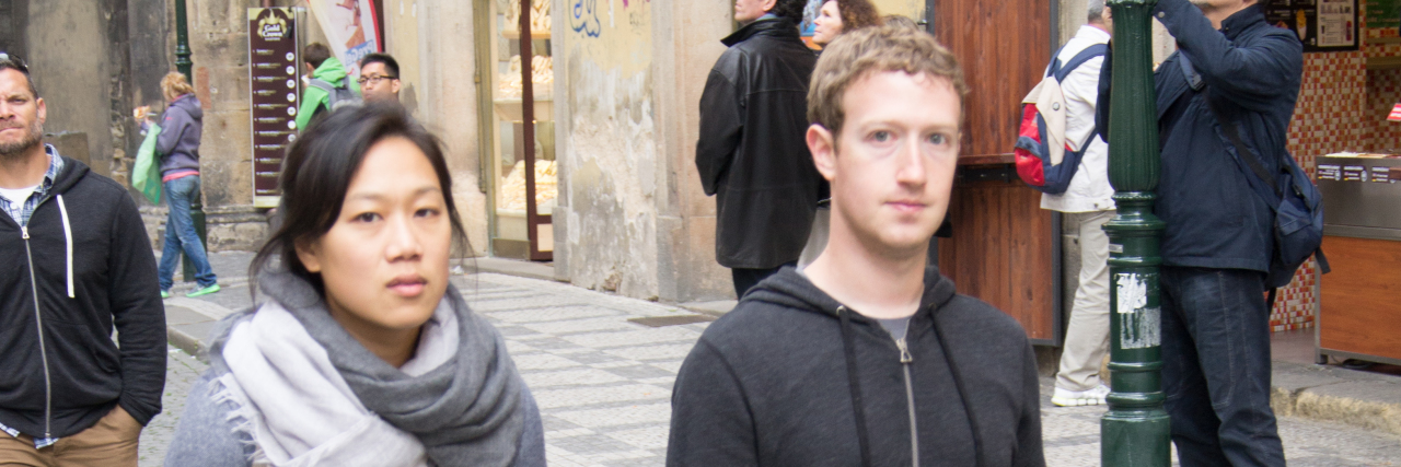 Mark Zuckerberg and Priscilla Chan walking on the streets of Prague