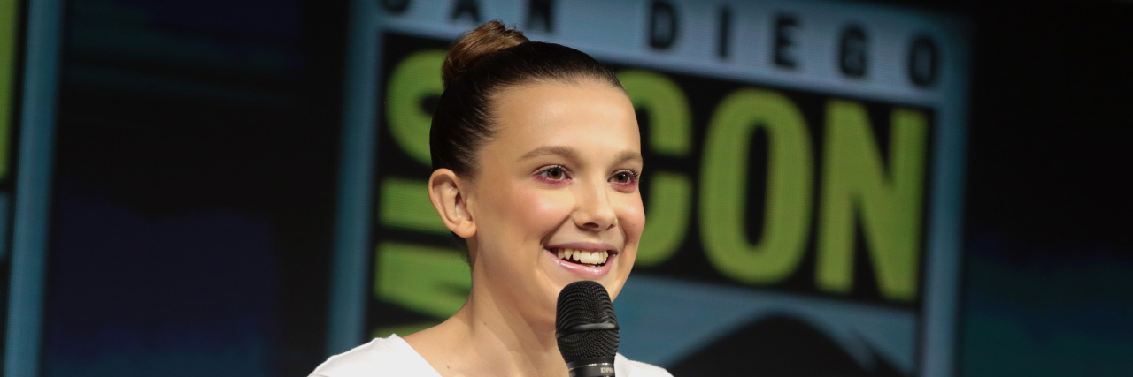 Millie Bobby Brown Shares What Being Partially Deaf Taught Her About Performing Millie Bobby Brown at a ComicCon panel