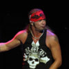 Bret Michaels dances onstage at his concert with his mic outstretched