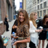 Nina Garcia smiles for the camera before going into a building