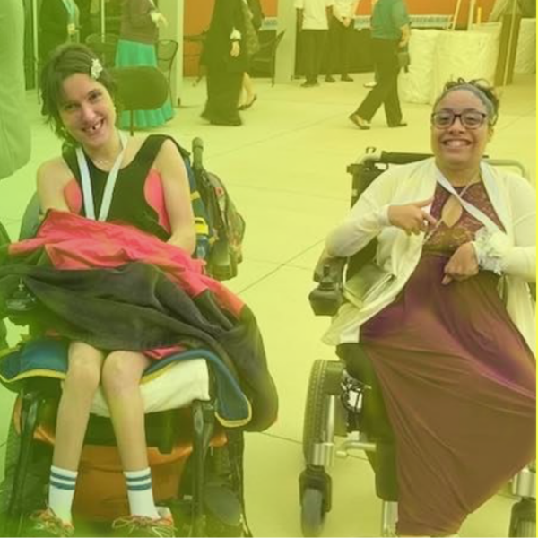 Two woman who have cerebral palsy sitting in wheelchairs. They're dressed up in formal clothing. There's a gradient over the photo that fades from green to yellow.