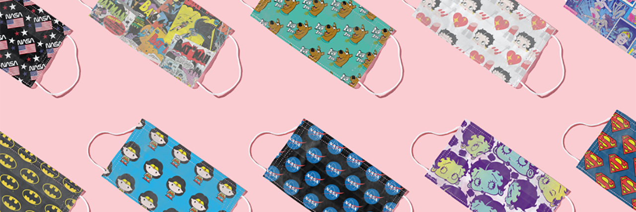 New Subscription Service MaskClub Offers Monthly Mask Delivery several colorful face masks on a pink table