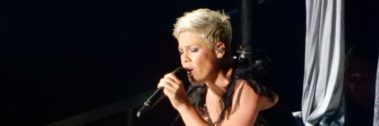 P!nk and Carey Hart Have Been In Couples Counseling for 17 Years Pink performs on stage in a black dress