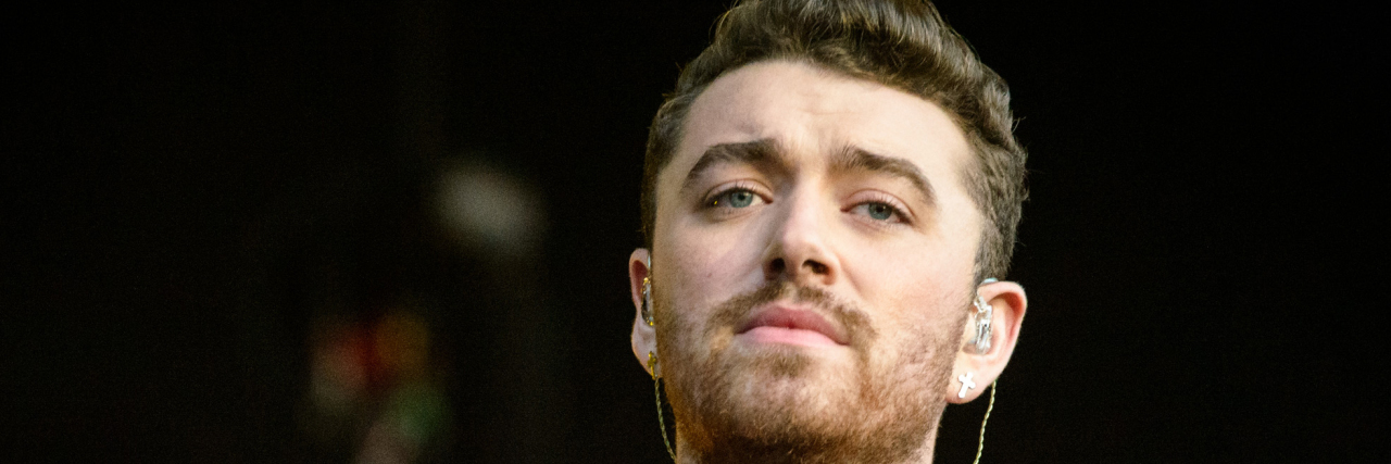 Sam Smith performs in a black and white outfit at Lollapalooza