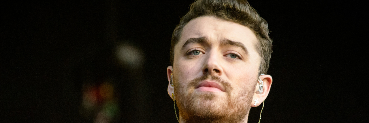 Sam Smith Shares the ‘Body Trauma’ They Experienced as a Child Sam Smith performs in a black and white outfit at Lollapalooza