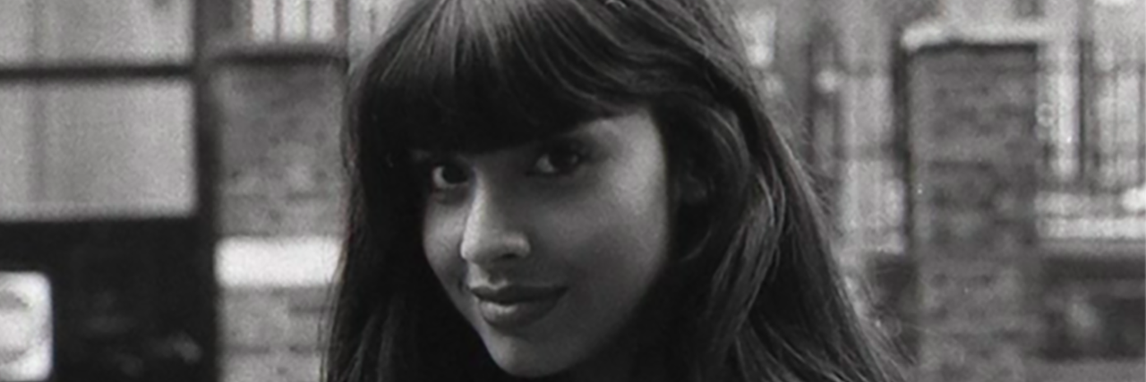 A black and white photo of Jameela Jamil