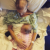 Joey Feek's daughter lays on top of her at a hospice center
