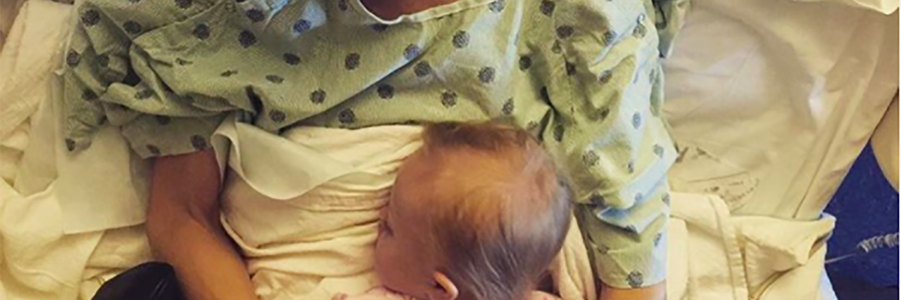 Country Stars Share Beautiful Photo of Mom and Daughter Joey Feek's daughter lays on top of her at a hospice center