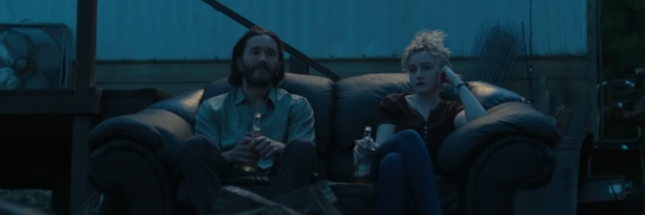 screenshot from season 3 of Ozard depicting ben davis on sofa with another character