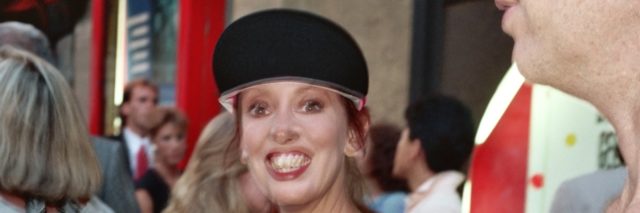 A blurry image of Shelley Duvall on the red carpet