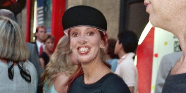 A blurry image of Shelley Duvall on the red carpet