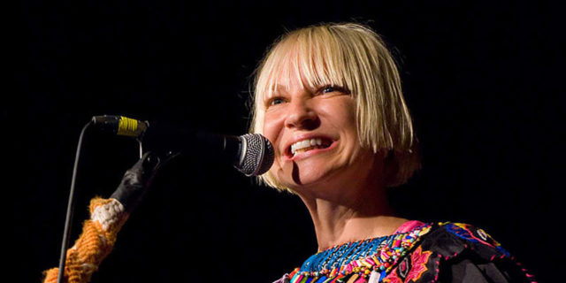 Sia Reveals She Has Ehlers-Danlos Syndrome Sia singing onstage in a black dress