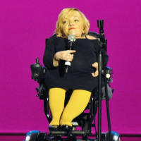 Stella Young, a wheelchair users, speaks onstage