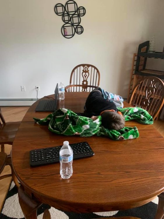 little kid taking a nap on dining table