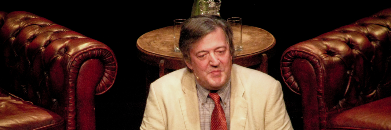 Comedian Stephen Fry Shares About Bipolar Disorder in Documentary Stephen Fry speaks from a podium at the Border Kitchen in a suit