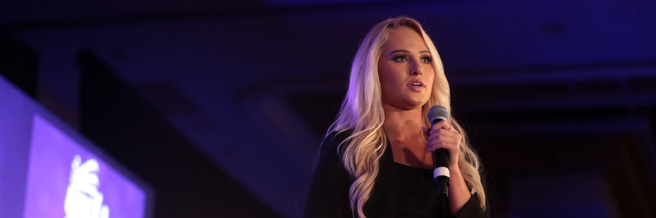 Tomi Lahren speaking at an event.