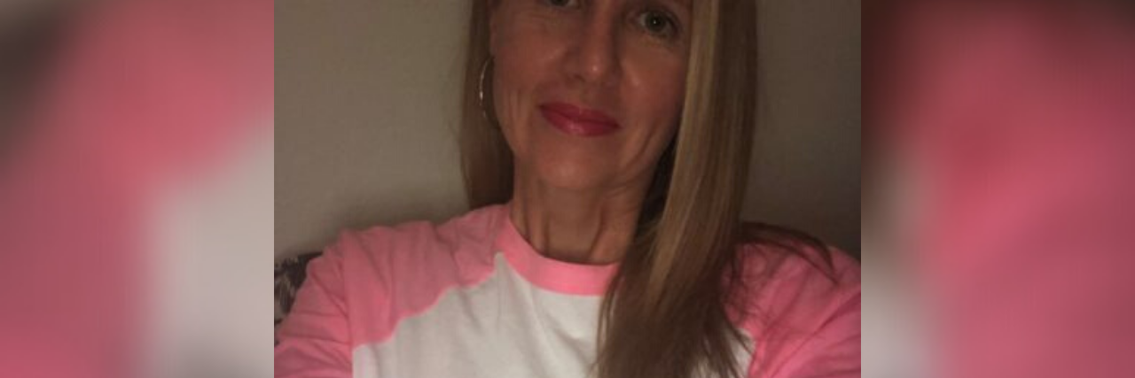 EMDR Therapy and Cutting My Mother Out Helped Me Process My Trauma selfie of author smiling wearing a shirt that says "no contact"