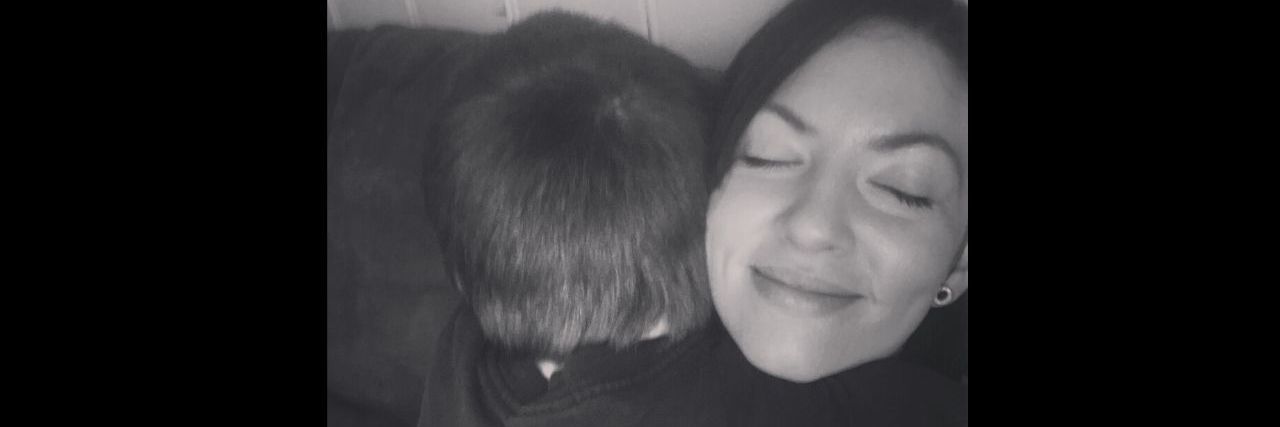 Parenting a Child With a Disability: A Test I Never Studied For A mother has her eyes closed as she hugs her son.