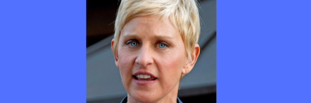 Ellen DeGeneres wears a blue suit while outsite