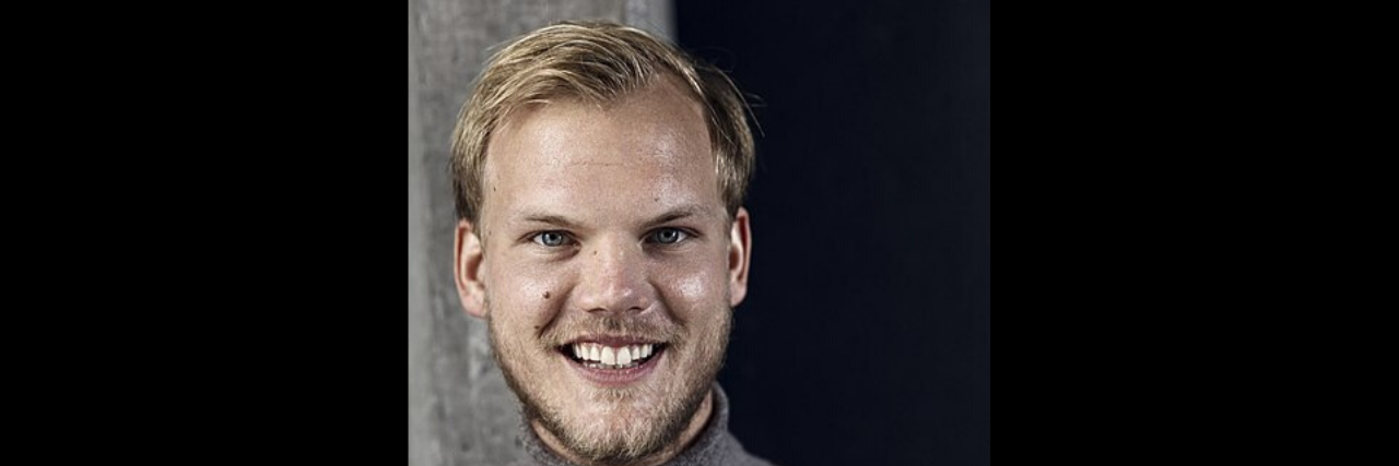 Avicii's Family Releases a Statement About His Mental Health A profile shot of Avicci in a grey turtleneck