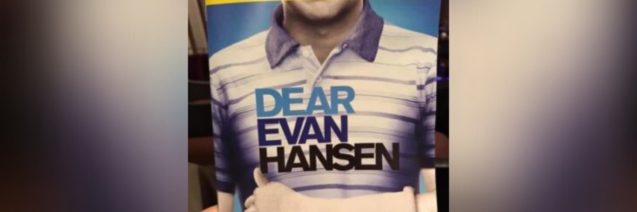 author holding the playbill for "Dear Evan Hansen"