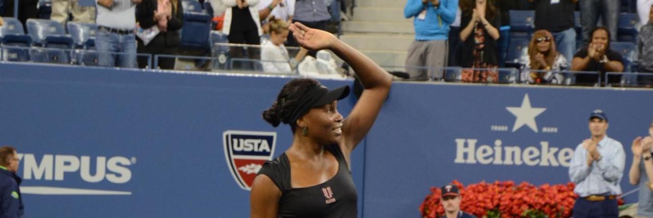 Venus Williams Explains How She Competes With Sjogren's Syndrome Venus Williams waves at the crowd from the tennis court
